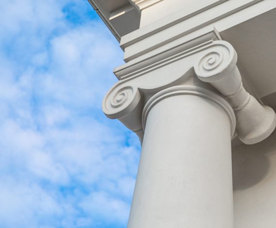 Architectural column of classicism style with whirl